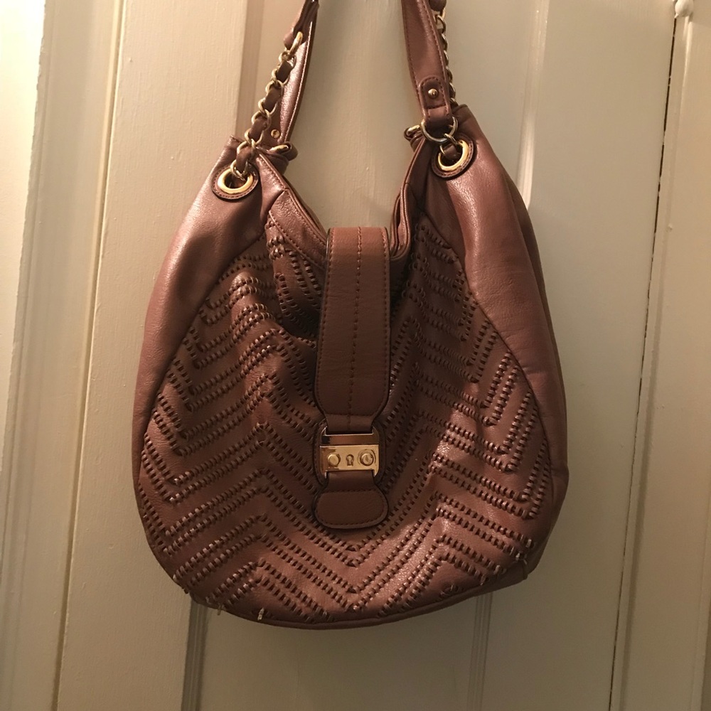 Big Buddha pink bag with long strap.